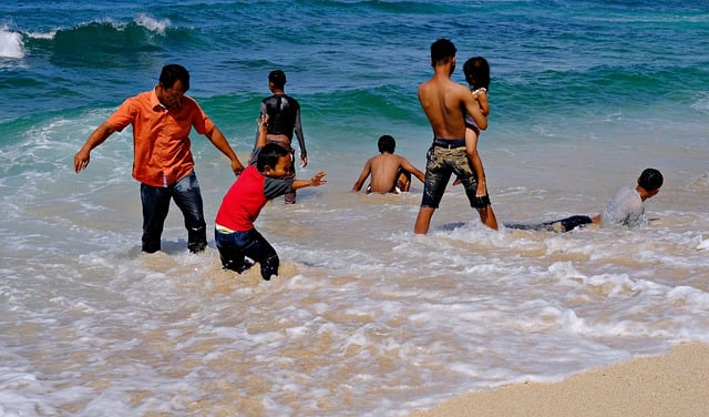 Free download beach playing happiness sea family free picture to be edited with GIMP free online image editor