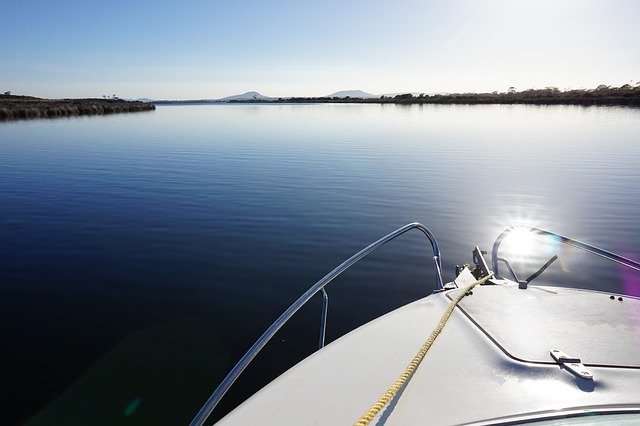 Free download Boat Still Water Lagoon -  free photo or picture to be edited with GIMP online image editor