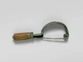 Free download Bronze bow-shaped fibula (safety pin) with bone cylinder free photo or picture to be edited with GIMP online image editor