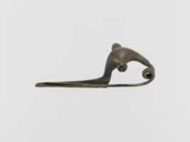 Free download Bronze bow-type fibula (safety pin) free photo or picture to be edited with GIMP online image editor