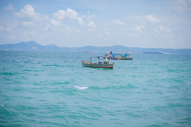 Free download fisherman boat sea beach clouds free picture to be edited with GIMP free online image editor