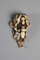 Free download Netsuke in the Shape of a Badger with a Sake Bottle and Bills for Sake free photo or picture to be edited with GIMP online image editor