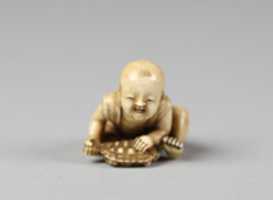 Free download Netsuke of Child with a Turtle free photo or picture to be edited with GIMP online image editor