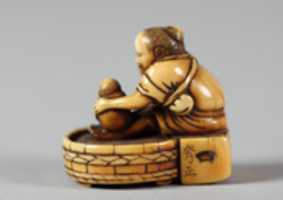 Free download Netsuke of Old Woman Bathing Child in a Tub free photo or picture to be edited with GIMP online image editor