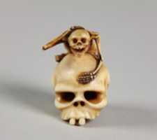 Free download Netsuke of Skeleton Astride a Skull free photo or picture to be edited with GIMP online image editor