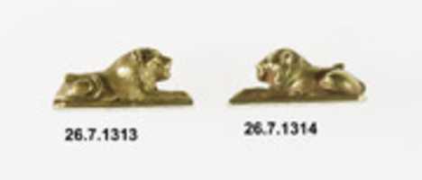 Free download Two recumbent lions from a bracelet free photo or picture to be edited with GIMP online image editor