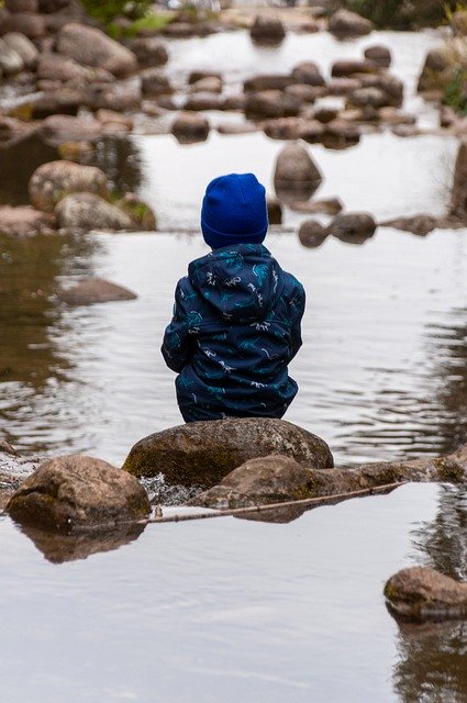 Free download child sitting stones river nature free picture to be edited with GIMP free online image editor