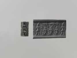 Free download Cylinder seal and modern impression: pharaoh wearing Double Crown, kneeling figures below vultures holding shn symbols; ankh free photo or picture to be edited with GIMP online image editor