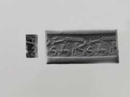 Free download Cylinder seal: animal combat with a lion and goats; sphinx on a snake free photo or picture to be edited with GIMP online image editor