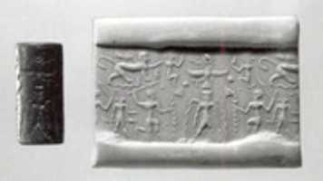 Free download Cylinder seal: bearded deity flanked by kneeling heroes; Horus and monkeys; ibex-demon; sphinx trampling serpents free photo or picture to be edited with GIMP online image editor