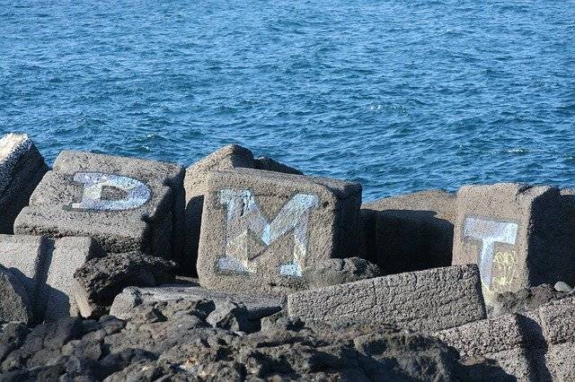 Kostenloser Download Graffiti Breakwater Sea - kostenloses Foto oder Bild zur Bearbeitung mit GIMP Online-Bildbearbeitung