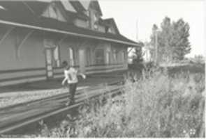 Free download Jeremy Walking Along The Railroad Tracks @ The Station In Hanna free photo or picture to be edited with GIMP online image editor