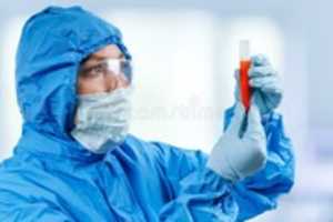 Free download medic-hazmat-protective-suit-holds-test-tube-coronavirus-positive-blood-sample-wuhan-china-ncov-medic-hazmat-172235984 free photo or picture to be edited with GIMP online image editor