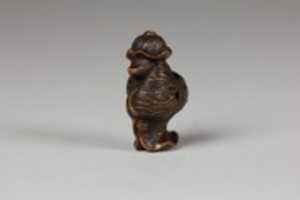 Free download Netsuke of Badger in Lotus Leaf free photo or picture to be edited with GIMP online image editor