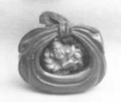 Free download Netsuke of Bag Containing a Figure of Hotei free photo or picture to be edited with GIMP online image editor