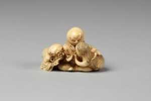 Free download Netsuke of Daruma Admonishing a Mermaid Serving Sake to an Octopus free photo or picture to be edited with GIMP online image editor
