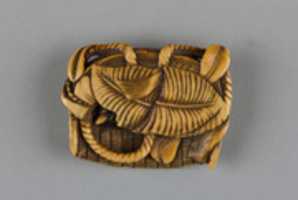 Free download Netsuke of Flat Basket Containing Leaves and a Mouse free photo or picture to be edited with GIMP online image editor