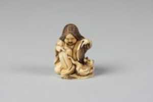 Free download Netsuke of Girl Playing with a Cat free photo or picture to be edited with GIMP online image editor