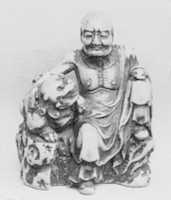 Free download Netsuke of Man and a Qilin Sitting on a Rock free photo or picture to be edited with GIMP online image editor