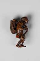 Free download Netsuke of Man Carrying Basket of Fish free photo or picture to be edited with GIMP online image editor