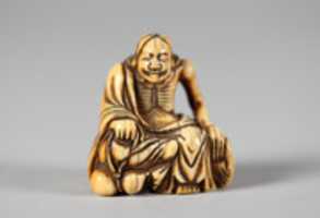 Free download Netsuke of Old Man Seated on a Rock free photo or picture to be edited with GIMP online image editor