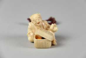 Free download Netsuke of Old Man with a Basket Containing Four Miniature Ivory Masks free photo or picture to be edited with GIMP online image editor