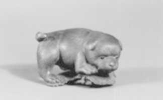 Free download Netsuke of Puppy on Straw Mat Biting String free photo or picture to be edited with GIMP online image editor