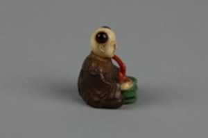 Free download Netsuke of Seated Man with a Flower Pot free photo or picture to be edited with GIMP online image editor