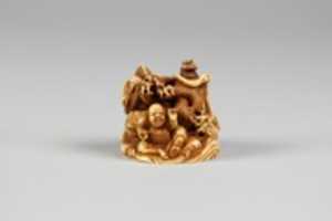 Free download Netsuke of Two Seated Figures and a Dragon free photo or picture to be edited with GIMP online image editor