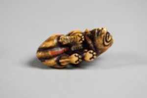 Free download Netsuke of Wolf Devouring Antelope Leg free photo or picture to be edited with GIMP online image editor