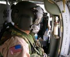 Free download UH 60 Black Hawk Door Gunner in Iraq free photo or picture to be edited with GIMP online image editor